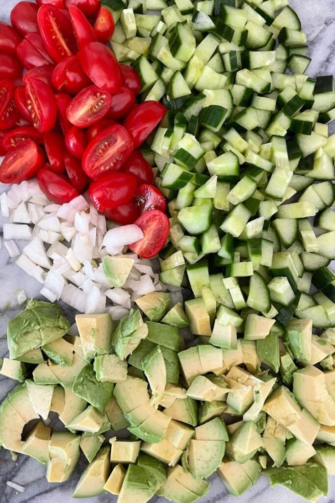 Ingredients for Avocado Salad - Cucumbers, Avocado, Grape Tomatoes, Vidalia Onion 
