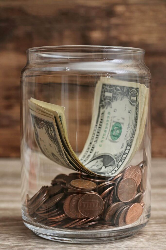 Frugal Living Tips - Simplified Expenses - Photo of Jar of Money 
