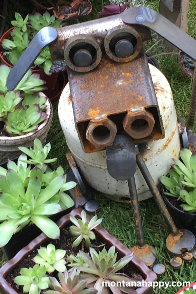 Rustic Garden Decor Ideas - Photo of Metal Garden Art Dog. Local garden shows are the perfect way to find yard art from junk. I found this adorable dog, whose body is made from an old propane tank at a garden show. You can also make your own yard art crafts at home.
