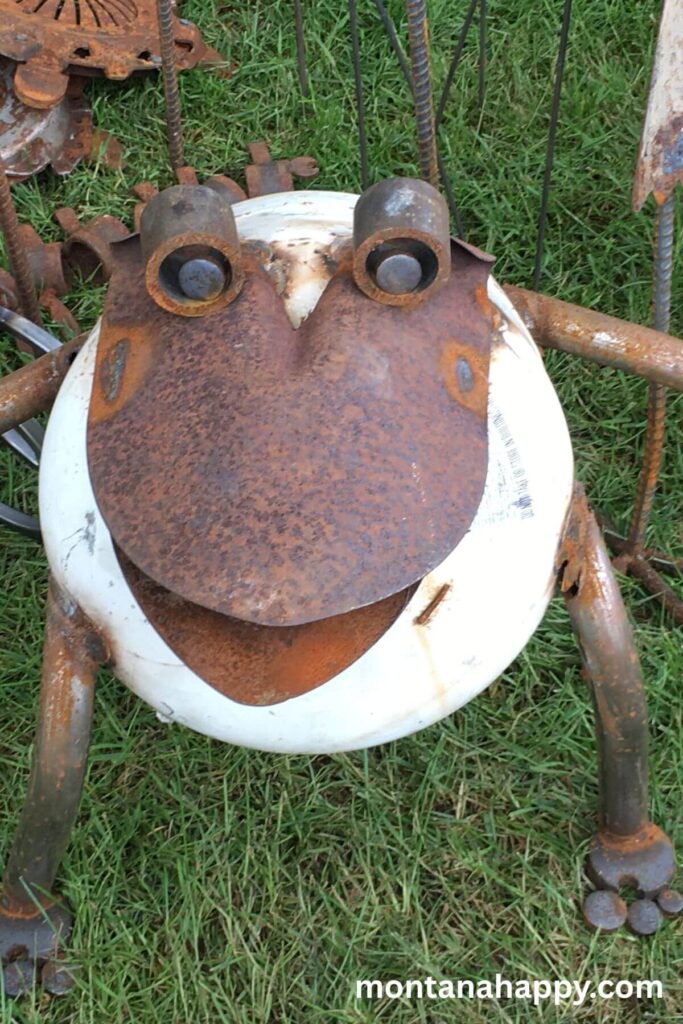 Rustic Garden Decor Ideas - Photo of a Whimsical Garden Art Frog. Adding Metal Yard Art to your garden is a fun way to bring a whimsical touch to your garden.