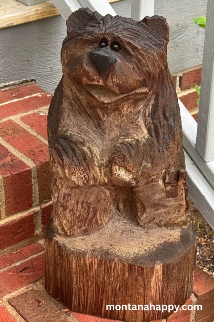 Rustic Gardening Ideas - Photo of a Bear Carved Wood Stump Art. If you're looking for unique garden art, chainsaw wood stump characters are the perfect way to add charm to your home.