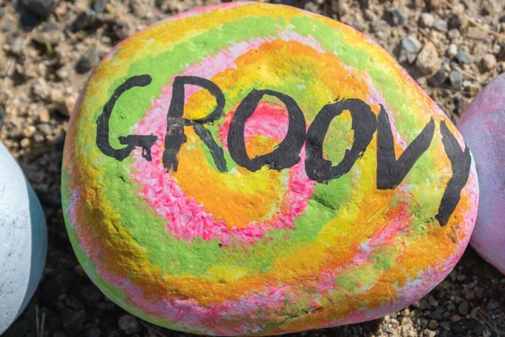 Rock Painting Words & Sayings - Photo of Rock with the Word Groovy on it