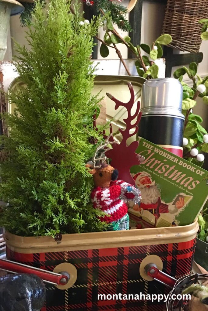 Rustic Christmas Decorating Ideas - Photo of Plaid Tin Basket with Christmas Tree, Christmas Children's book, thermos, and Reindeer 