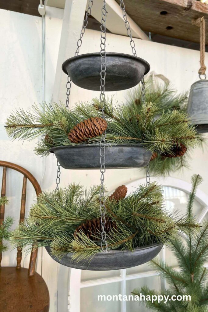 Rustic Christmas Display - Hanging Metal Baskets with Evergreen Sprigs and Pinecones