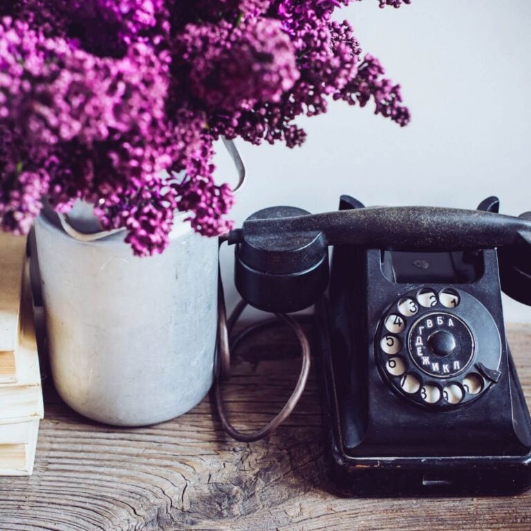 How to Hygge Your Office Cozy Office Decor Ideas * photo of an antique phone and a vase of lilacs