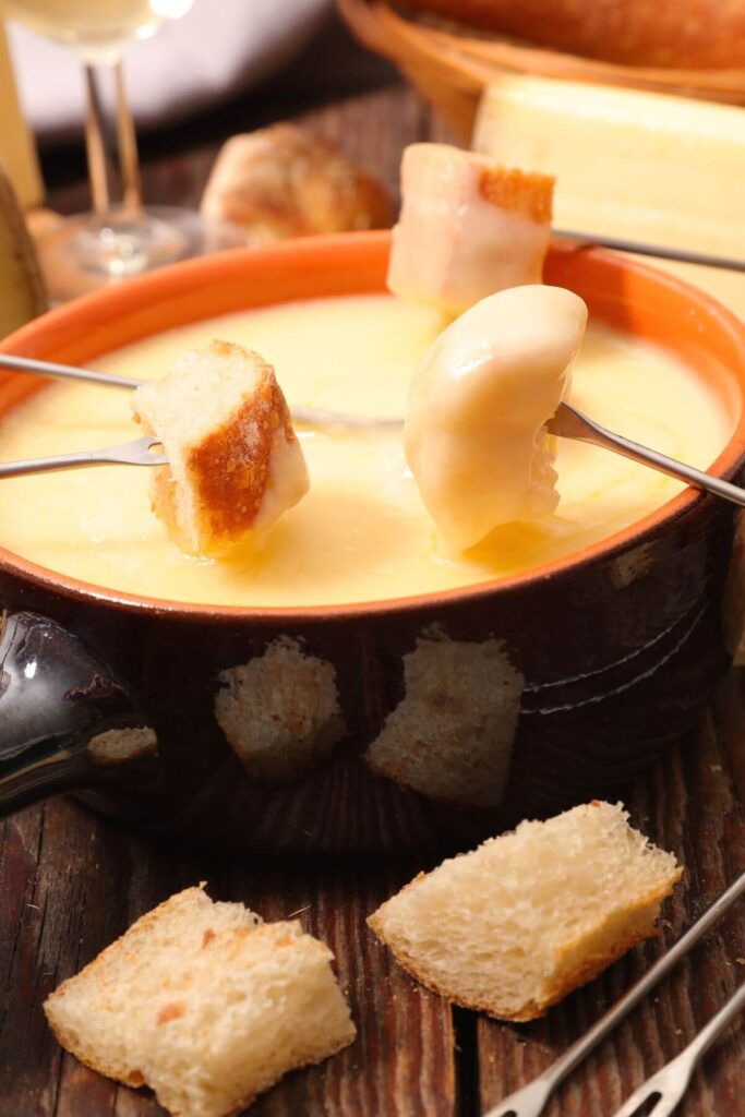 Hygge Family Dinner Traditions - Fondue Night - Photo of Cheese Fondue and Bread with Skewers