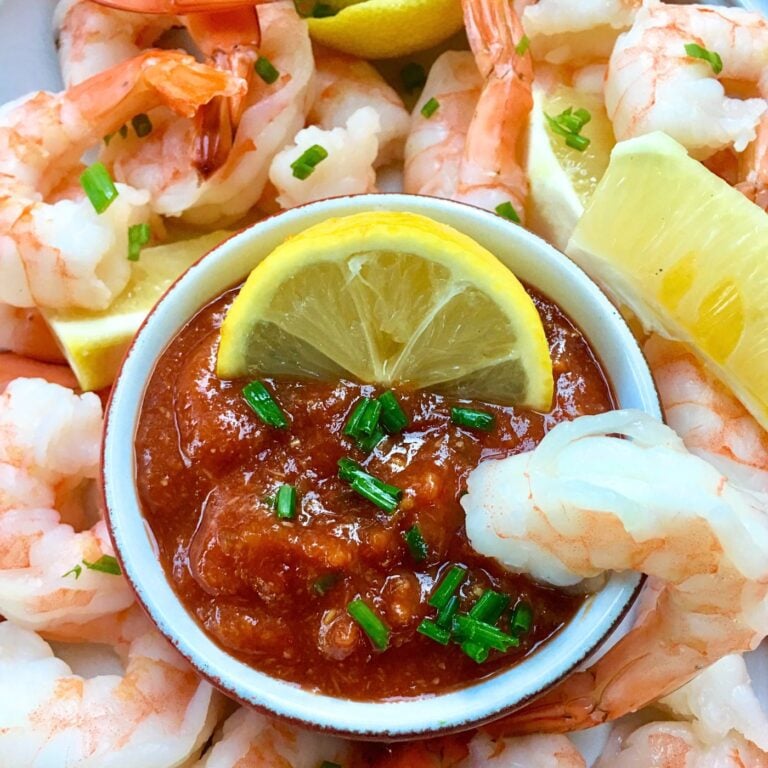 Homemade Cocktail Sauce Served with Shrimp and Lemons