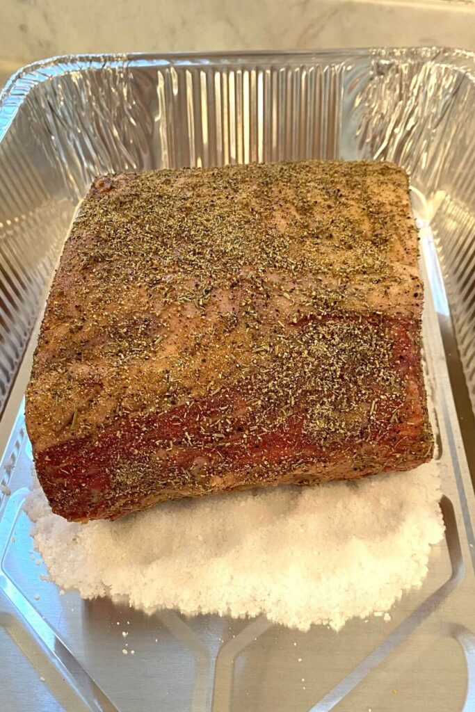 Salt Encrusted Prime Rib with Worcestershire Sauce & Spices on a Bed of Salt 