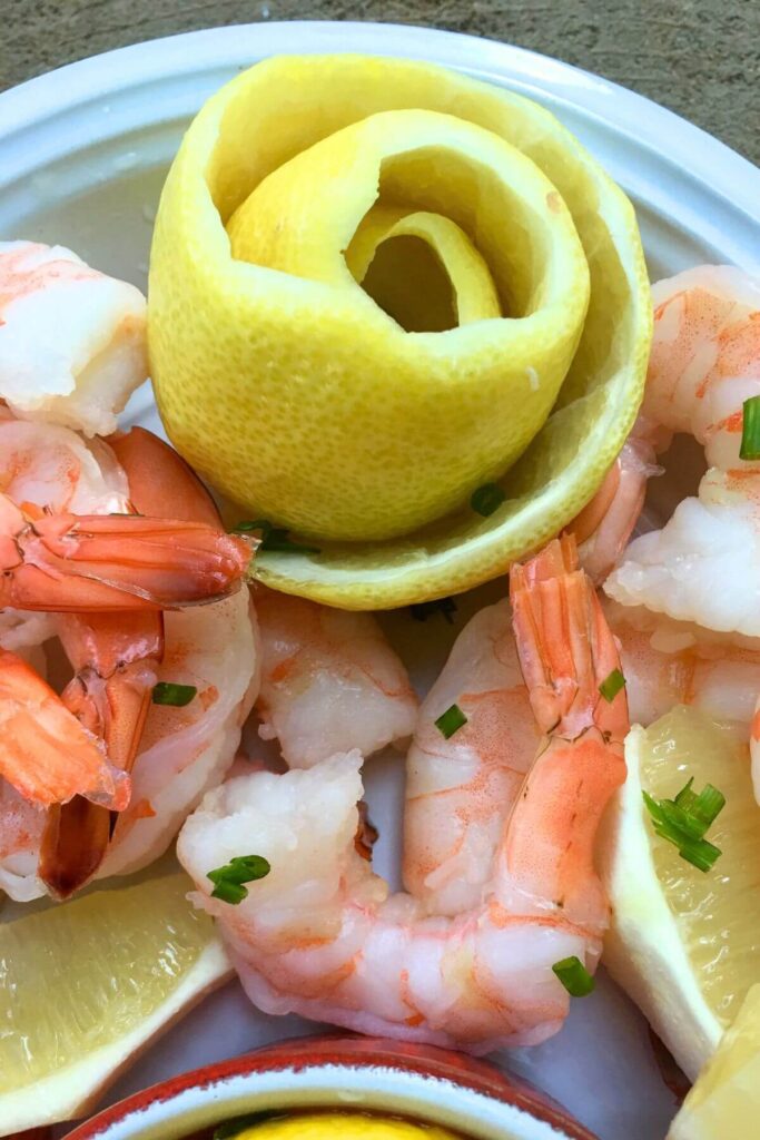 Simple Shrimp Cocktail Sauce Recipe with Cold Shrimp and Lemon Rose Garnish