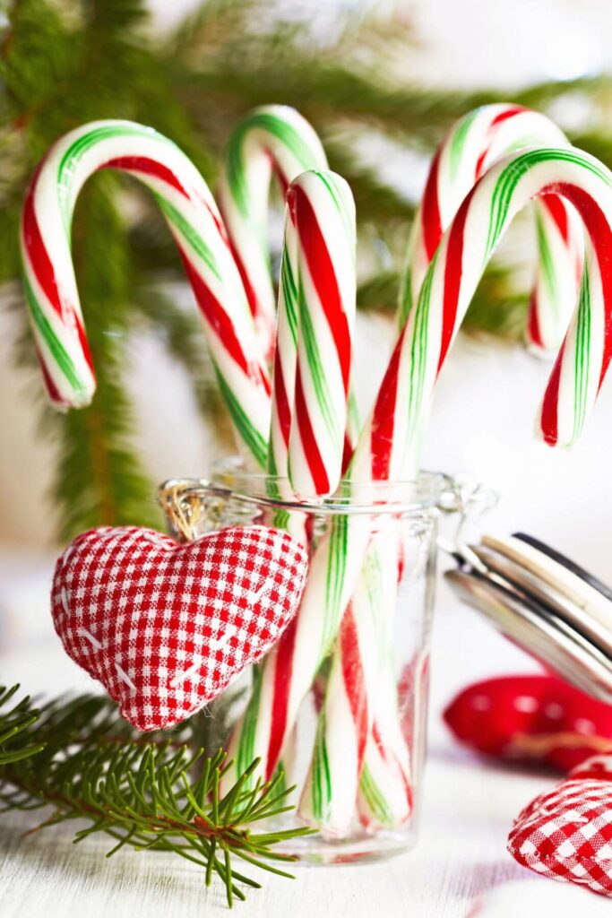 Creative Inexpensive Christmas Decorations - Photo of Candy Canes in a Jar with a Gingham Heart