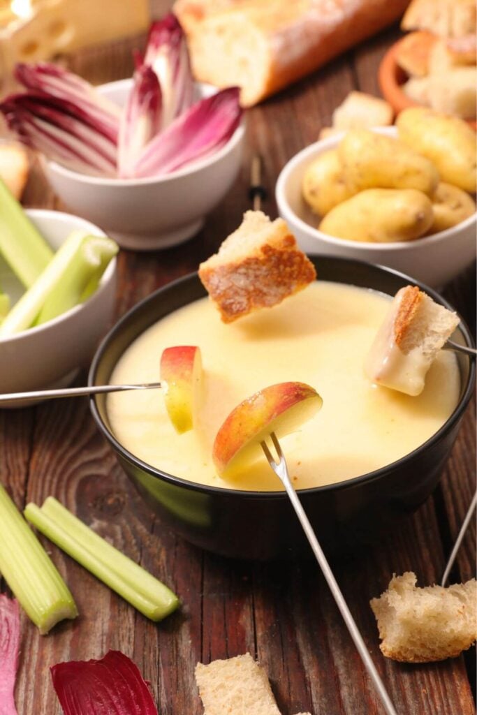 Simple Cheese Fondue Recipe with Apple, Bread, Celery, and Potato Dippers
