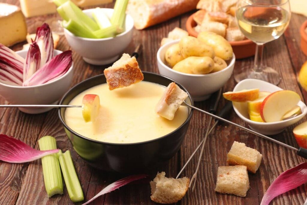 The Best Cheese Fondue Recipe - Cheese Fondue Dippers: Cubed Bread, Endive, Celery, Potatoes, and Apples, Pears