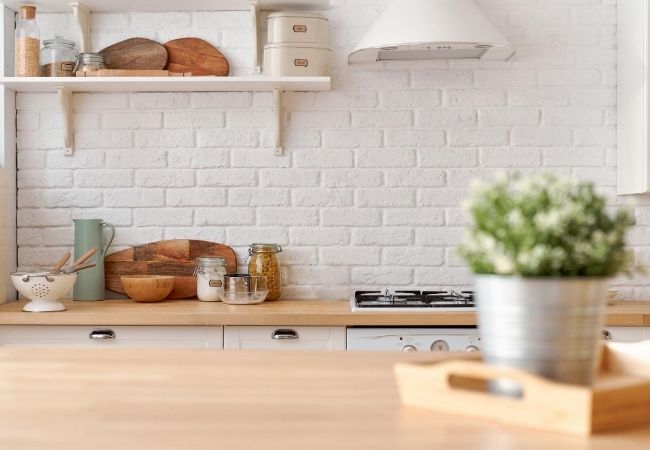 Simple Kitchen with White Brick Wall and Minimal Clutter