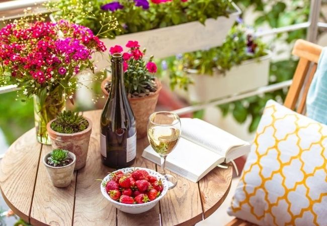 Outside Bistro Table with Flowers, Wine, and Berries