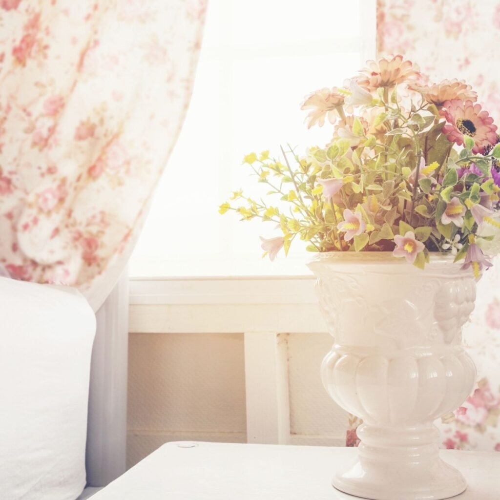 Ideas on Keeping Your House Clean and Tidy - Let the Sunshine in - Window with floral curtains and a vase of flowers