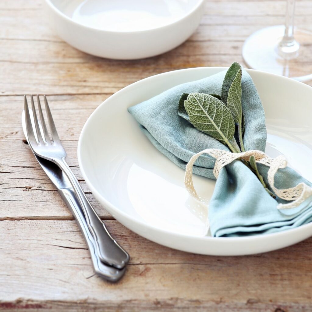 Tidy Home Dining Table with one place setting, napkin and silverware