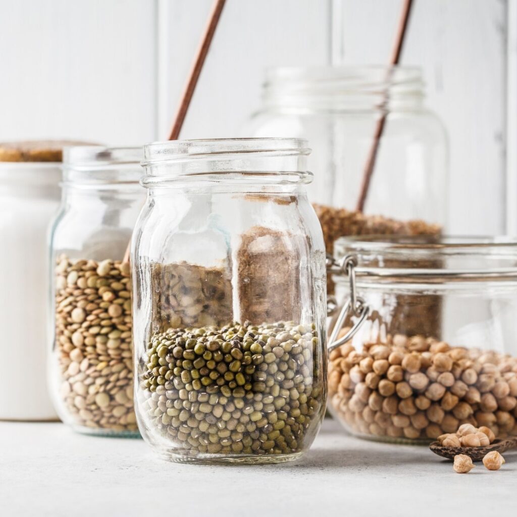 Tiny Home Pantry Story - Clear glass jars filled with dried lentils and beans