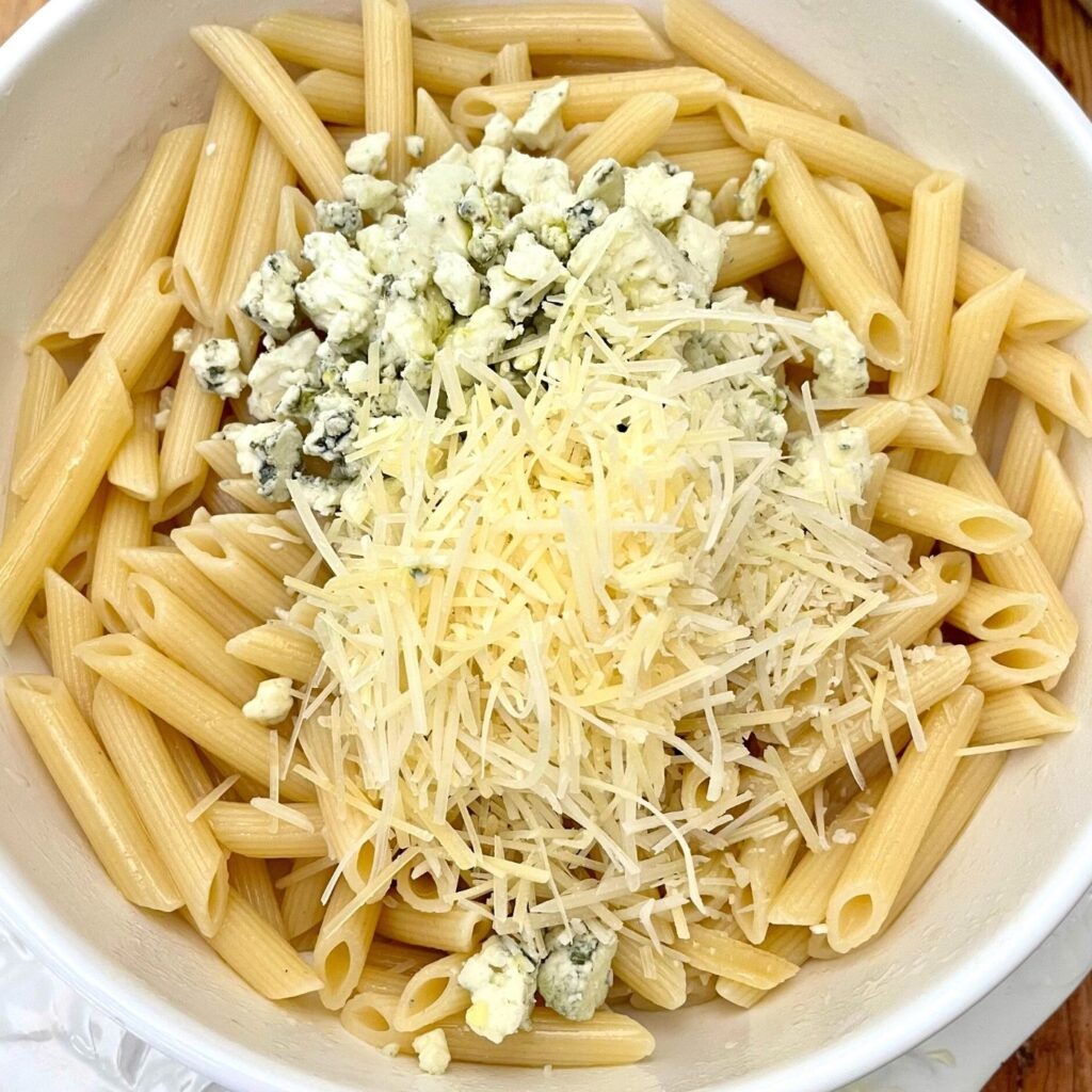 Balsamic Gorgonzola Chicken Pasta Recipe - pasta with the Gorgonzola and Parmesan cheese being mixed with the pasta