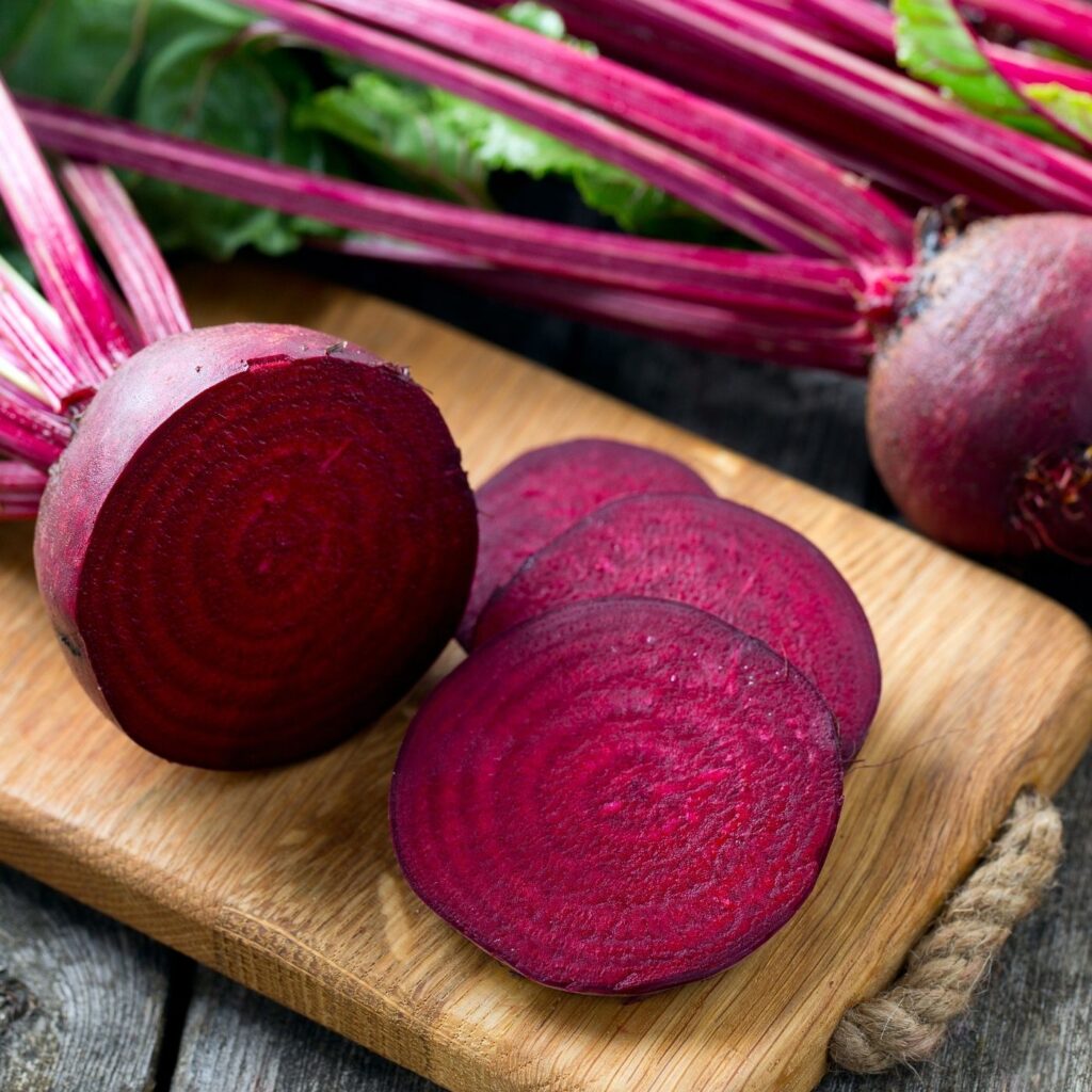 Ingredients for Orange Carrot Beet Juice Recipe - Fresh beets with greens