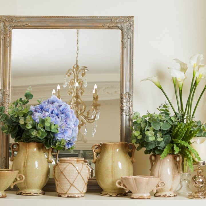 Mirrors Create a Peaceful Setting by Reflecting Light - Mirror on a Mantle with plants and flowers