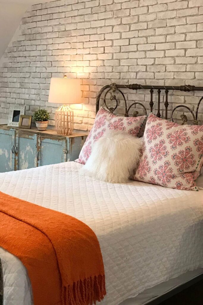 Cozy Hygge Bedroom with Iron Headboard and Throw Pillows 