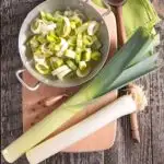 Leeks: How to Buy, Store, Cut & Cook - Fresh Leeks and cut leek on a cutting board