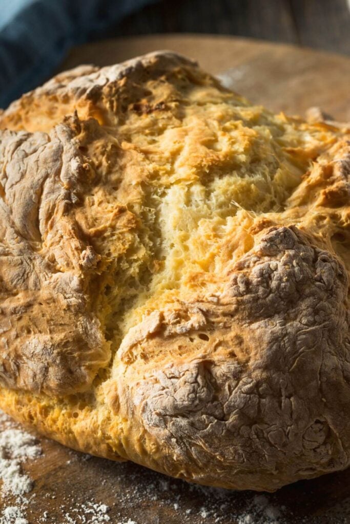 Simple  Irish Soda Bread Recipe - Photo of a Loaf of Simple Soda Bread with a Bread Knife 
