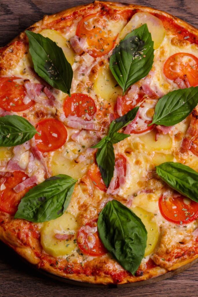 The Best Pizza Toppings - Sliced Tomatoes, Potatoes, Red Onions, and Fresh Basil