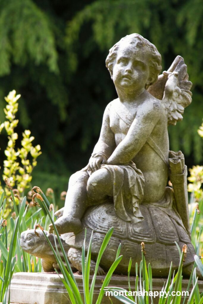 Enchanting Design Elements of an English Cottage Garden - Photo of a Cement Garden Angel 