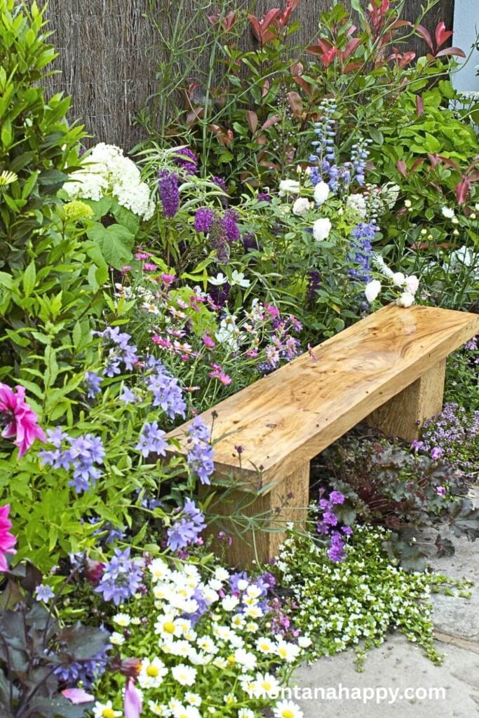 English Cottage Garden Design Ideas - Wooden Bench in Flowers 