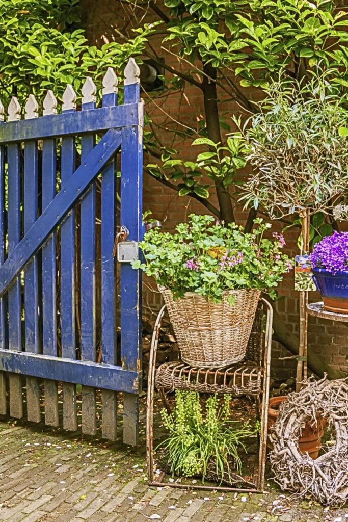 English Cottage Garden Decor Ideas - Photo of a Blue Gate with Potted Plants 