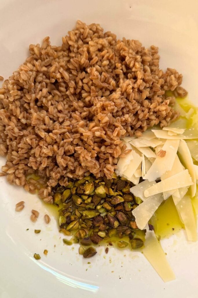 Charlie Bird's Farro Salad Recipe - Photo of Farro, Parmesan Cheese, Pistachios, Lemon Juice, and Olive Oil 