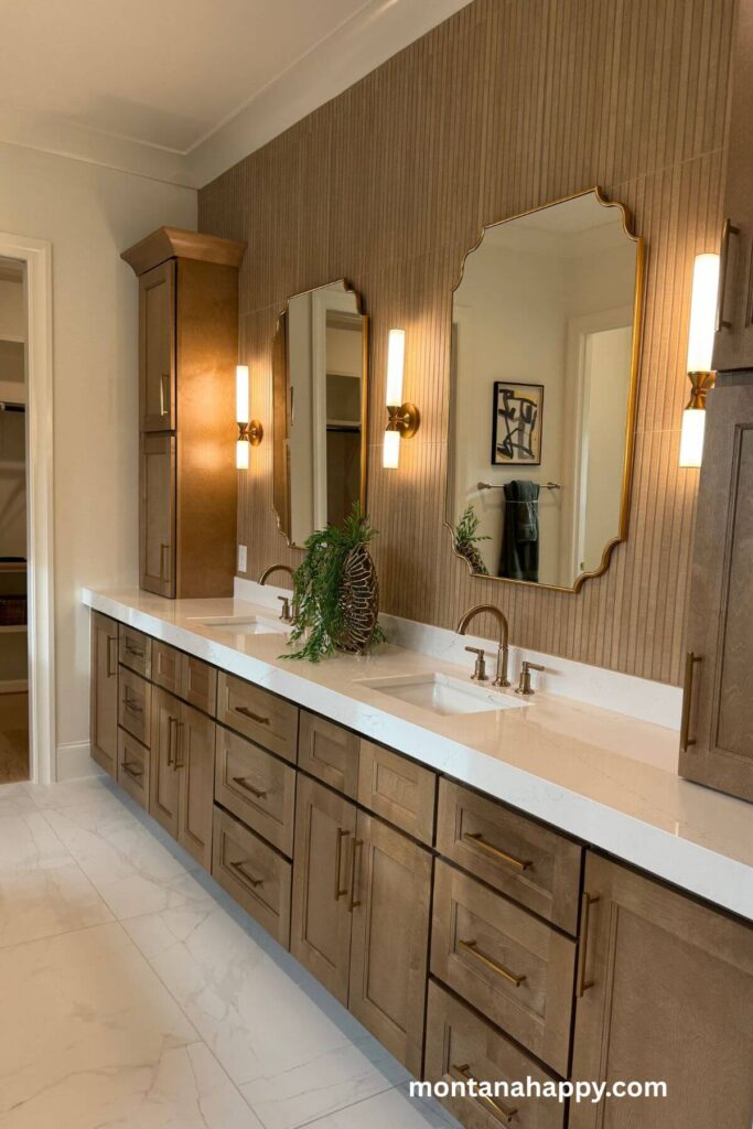 Modern Decorating Ideas - Photo of Wood Modern Bathroom Design -A modern bathroom feels warm and elevated with its rich wood cabinets and matching wood paneling, all accented by sleek brass handles and fixtures.