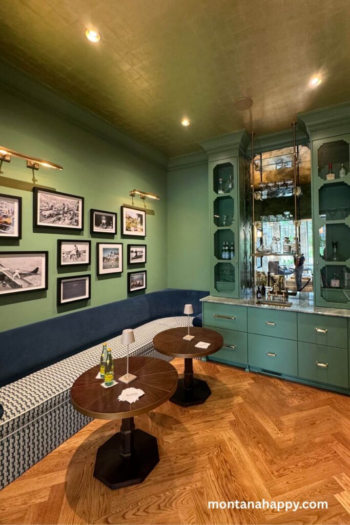 Modern Home Decor Ideas - Photo of Modern Home Interior Bar - This modern interior feels like a chic cocktail lounge, with a sleek bar area paired perfectly with a cozy couch. The warm, wood floors tie everything together, adding an inviting, upscale vibe to the space.