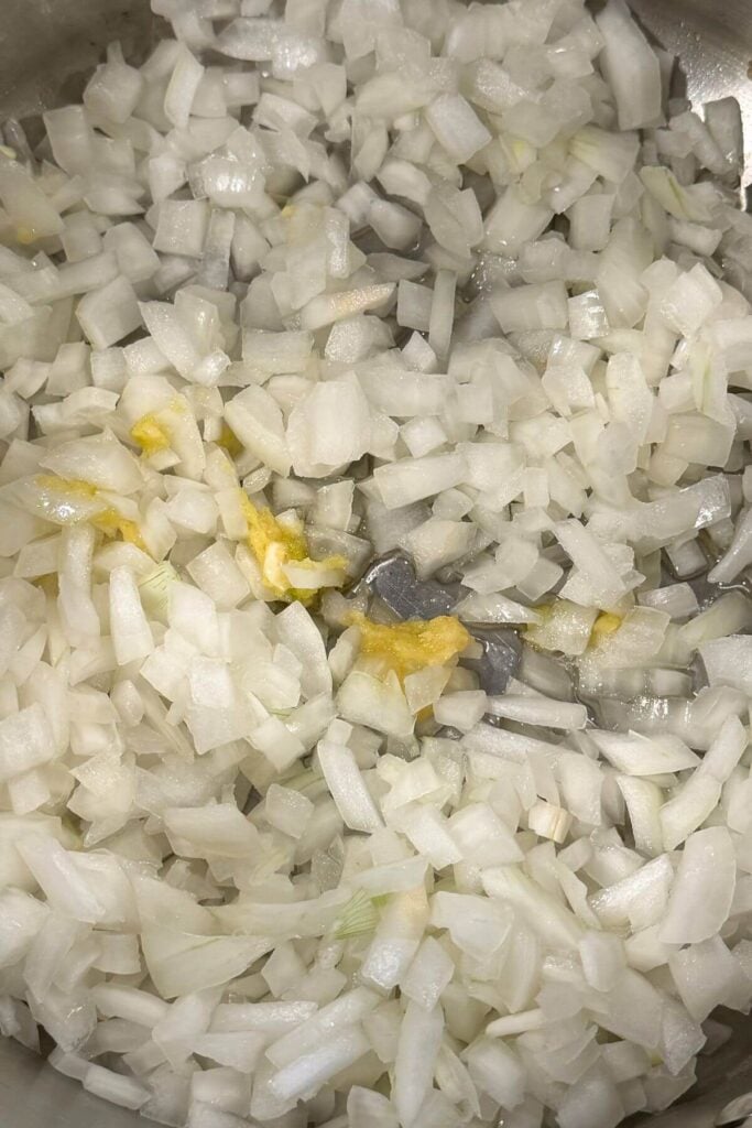 Photo of Ingredients Chopped Onions and Minced Garlic In a Sauté Pan -2