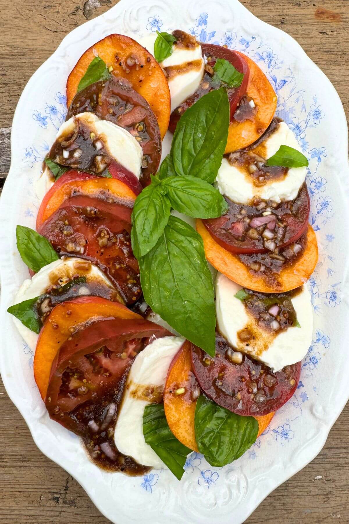 Photo of Peach Caprese Salad for Grilled Chicken on an Oval Platter