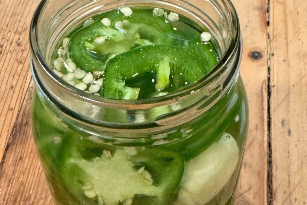 Photo of Quick Pickled JalapeƱos Recipe in a Mason Jar